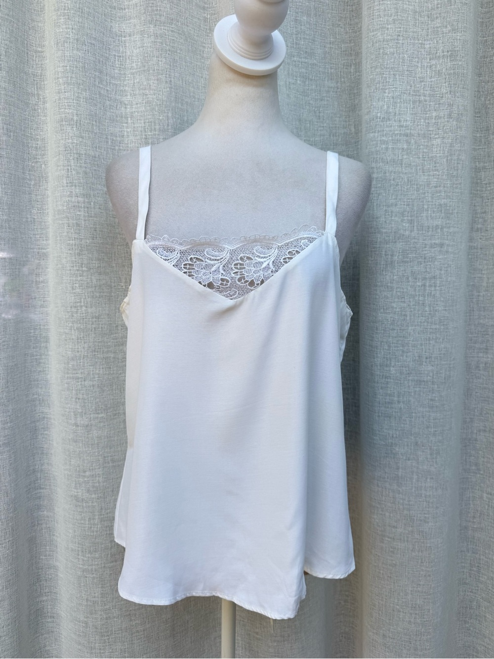 Anxiety white sleeveless blouse